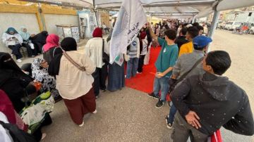 طوابير الناخبين تصطف أمام لجنة مدرسة الوراق الثانوية بنات وسط تأمين مشدد