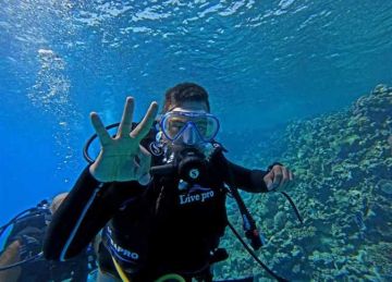 محمد كرم.. أول غواص مصري من أصحاب متلازمة داون يلامس أعماق الجفتون