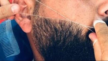 حكم حلق اللحية وأخذ الوجه بالفتلة لمن يعمل حلاقا..الإفتاء تجيب