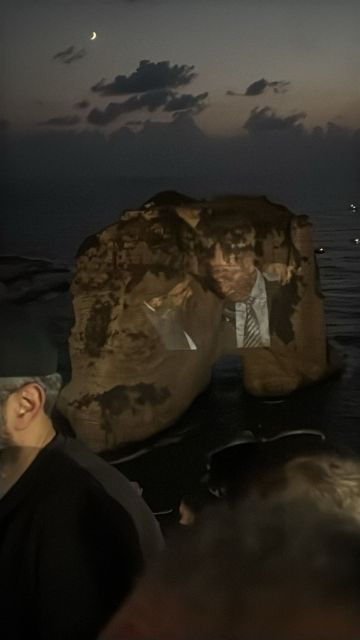 اضاءة صخرة الروشة بصورة السيد نصرالله والرئيس بري