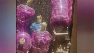 بالصورة: أموال داخل قوارير مياه بالصورة: أموال داخل قوارير مياه