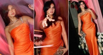 منة عرفة بفستان برتقالي ساتان في أحدث ظهور