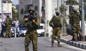 اقتحامات واعتقالات إسرائيلية بالضفة واعتداء على شاب