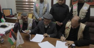 بالصور توقيع اتفاقية لإنشاء مخيم إيواء موظفي بلدية غزة