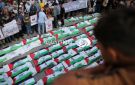بالصور: غزة : تشييع جثامين 100 شهيد في حي الزيتون