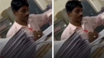 عامل نظافة يقوم بتصحيح امتحانات الطلاب في جامعة هندية .. فيديو