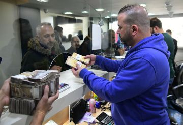 الليرة السورية تواصل التعافي أمام الدولار الأمريكي